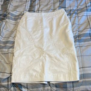 Custom designed white leather midi skirt.
